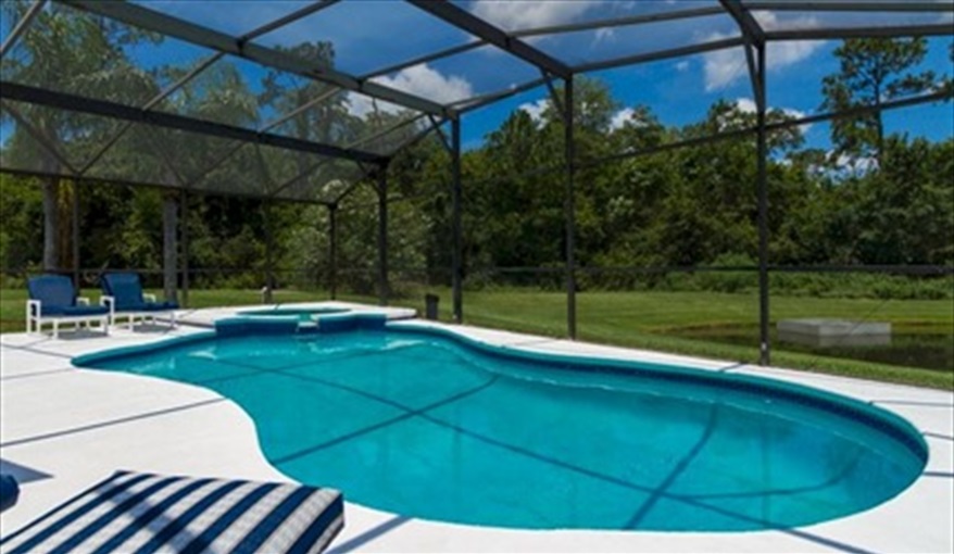 Enough pool furniture for everyone. Roughtallys in Lake Berkley Resort, Kissimmee, Orlando
