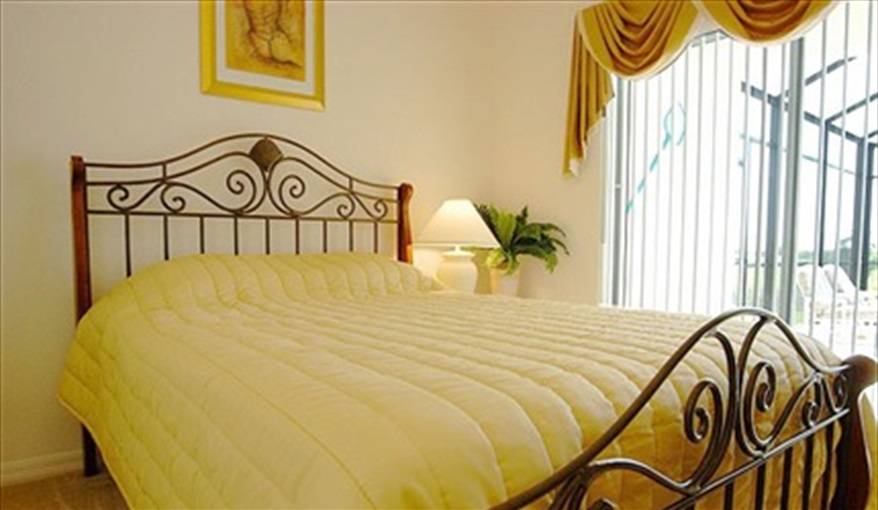 Sunny ground floor master with access to pool deck. *Villamagic* in The Sanctuary At Westhaven, Davenport, Orlando