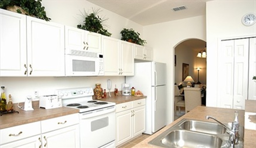 Family room opens onto the kitchen. *Villamagic* in The Sanctuary At Westhaven, Davenport, Orlando
