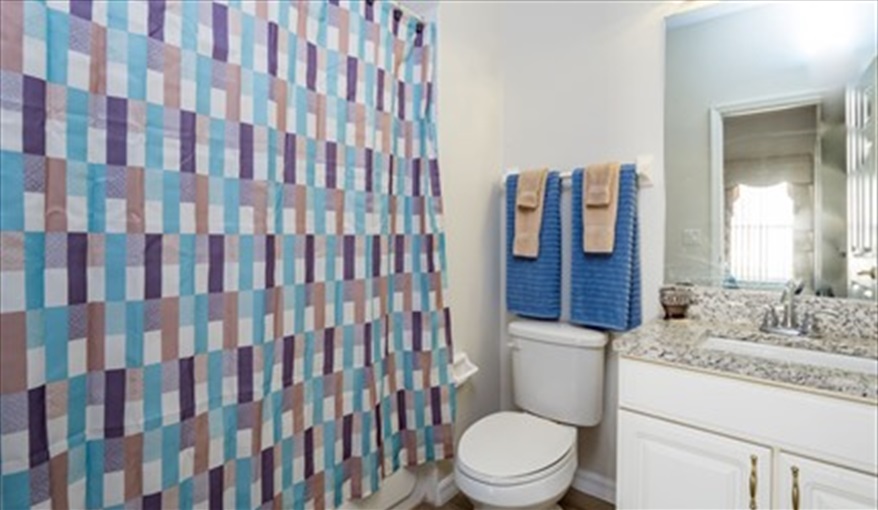 En-suite bath with wall mounted shower . Brown's Villa in Cumbrian Lakes, Kissimmee, Orlando