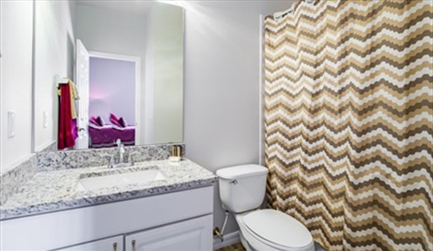 En-suite bathroom ground floor
bath and shower over the bath . Brown's Villa in Cumbrian Lakes, Kissimmee, Orlando