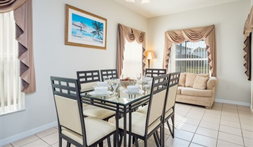 Dinning table and chairs. Brown's Villa in Cumbrian Lakes, Kissimmee, Orlando