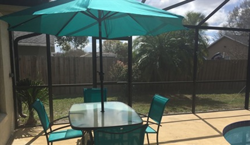 Patio Table Seating 6 with Parasol. FLORIDA HOME in Pine Chase Estates, St Cloud, Gulf Coast