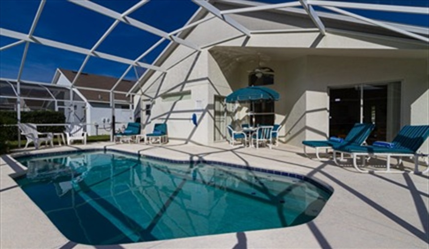 Large South facing pool deck with covered lanai and fan. JCHolidays in The Manors At Westridge, Davenport, Orlando