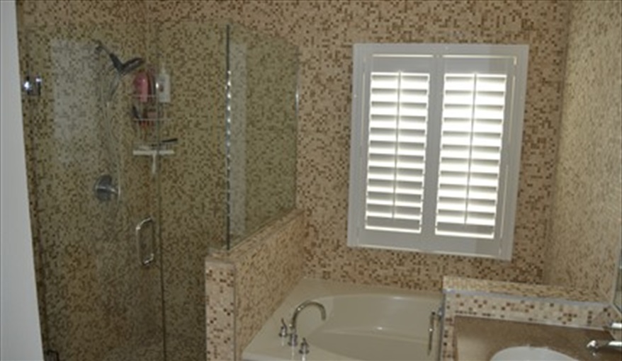 Mosaic tiled en-suite with glass shower. Waterside in Eagle Pointe, Kissimmee, Orlando