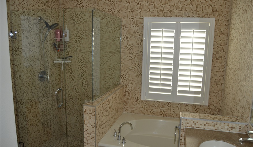 Mosaic tiled en-suite with glass shower. Waterside in Eagle Pointe, Kissimmee, Orlando