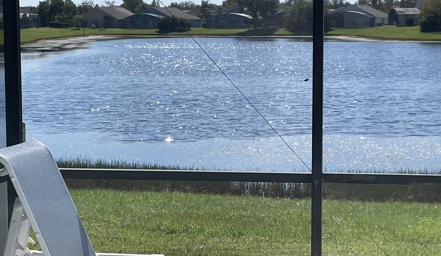 Enjoy the view from your comfortable sun bed. Waterside in Eagle Pointe, Kissimmee, Orlando