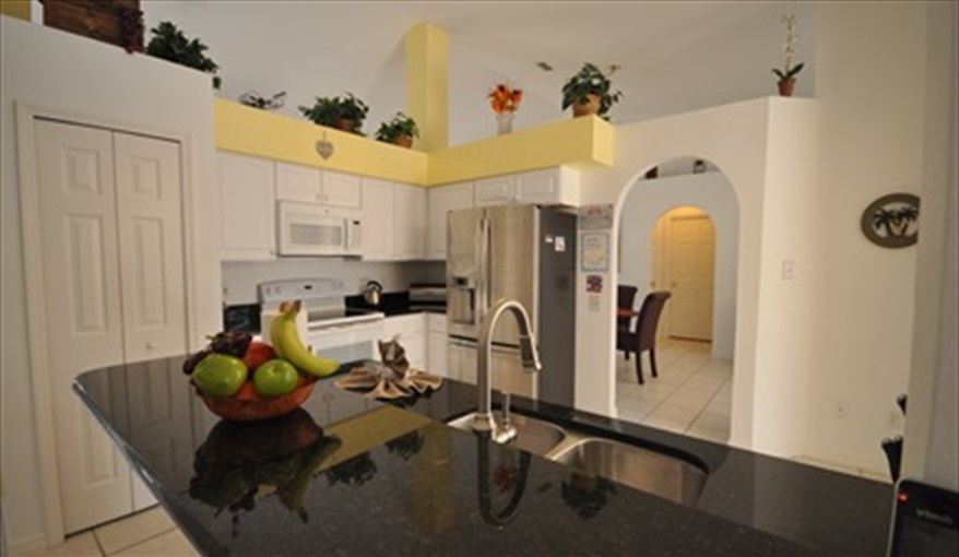 Fully Equipped kitchen with granite worktops. Palm Tree Villa - Pool Lift, 5 STAR RATING in Doral Woods, Kissimmee, Orlando