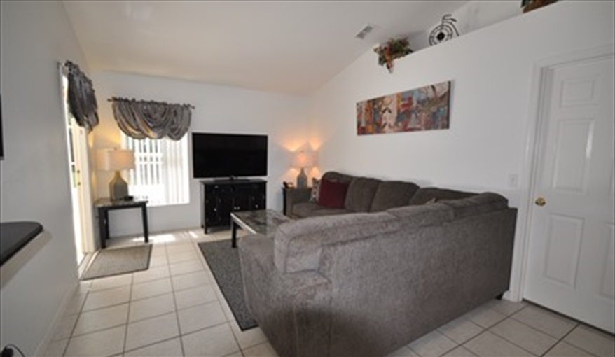 watch a movie on the large 55" Flat screen TV. Palm Tree Villa - Pool Lift, 5 STAR RATING in Doral Woods, Kissimmee, Orlando