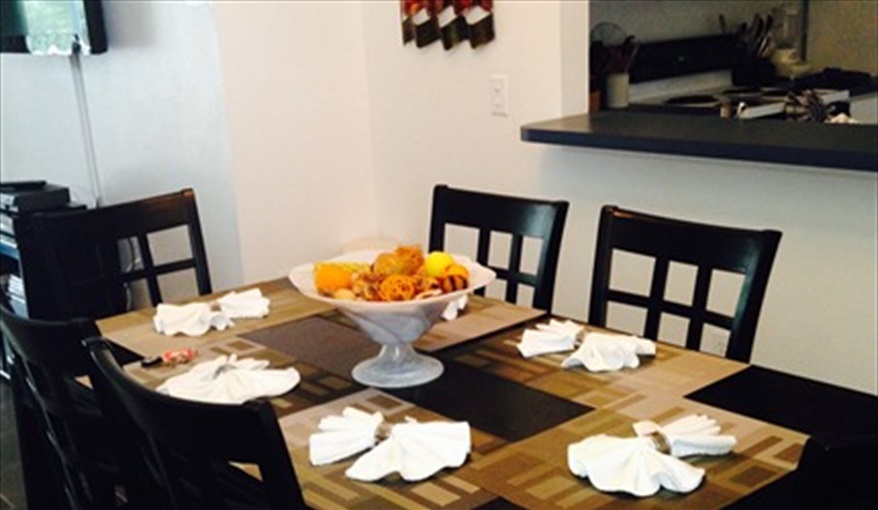 Large dark wood Dining Table ideal for both formal or casual dining. Villa Paradiso  in Eagle Pointe, Kissimmee, Orlando