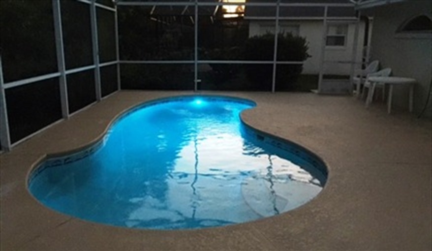 Different Pool colors to enhance your relaxing evening under the lanai.... Villa Paradiso  in Eagle Pointe, Kissimmee, Orlando