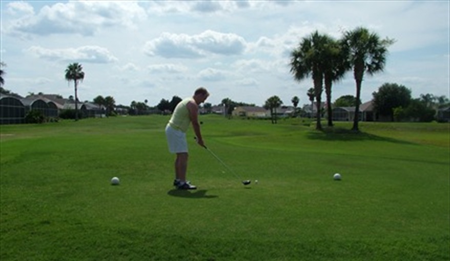 Play a round on the 9 hole golf course on site. My Florida House  in Esprit, Davenport, Orlando