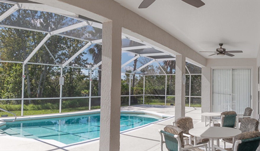 Covered Lanai with Ample Tables and Chairs. Hills Bay Hideaway in Bridgewater Crossing, Davenport, Orlando