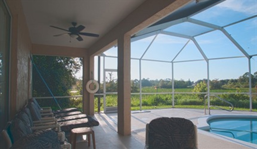 Plenty of tables, chairs and sun loungers. Hills Bay Hideaway in Bridgewater Crossing, Davenport, Orlando