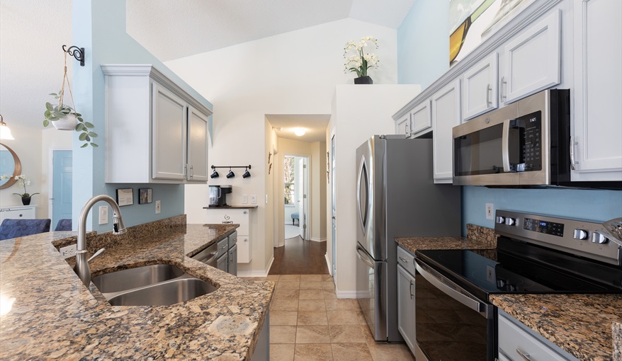 Fully equipped kitchen with granite countertops and stainless steel appliances for effortless meal p. For the Best Disney Vacation-Tropical Paradise Villa in Emerald Island Resort, Kissimmee, Orlando