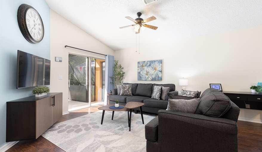 Comfortable living room with plenty of seating and direct access to outdoor space.. For the Best Disney Vacation-Tropical Paradise Villa in Emerald Island Resort, Kissimmee, Orlando