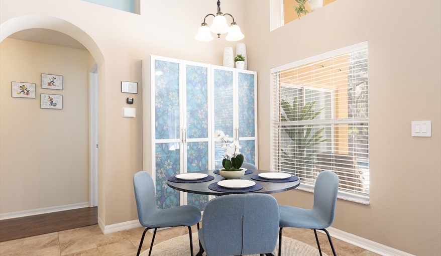 Cozy breakfast nook with natural light and calming coastal tones.. For the Best Disney Vacation-Tropical Paradise Villa in Emerald Island Resort, Kissimmee, Orlando