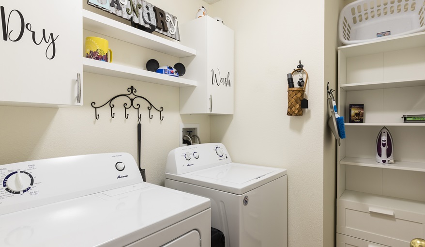 Dedicated laundry room with full-size washer and dryer, making it easy to handle swimsuits, theme pa. For the Best Disney Vacation-Tropical Paradise Villa in Emerald Island Resort, Kissimmee, Orlando