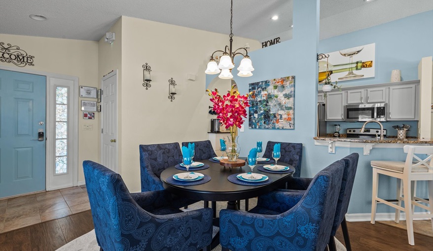 Comfortable dining space with modern lighting and open layout.. For the Best Disney Vacation-Tropical Paradise Villa in Emerald Island Resort, Kissimmee, Orlando