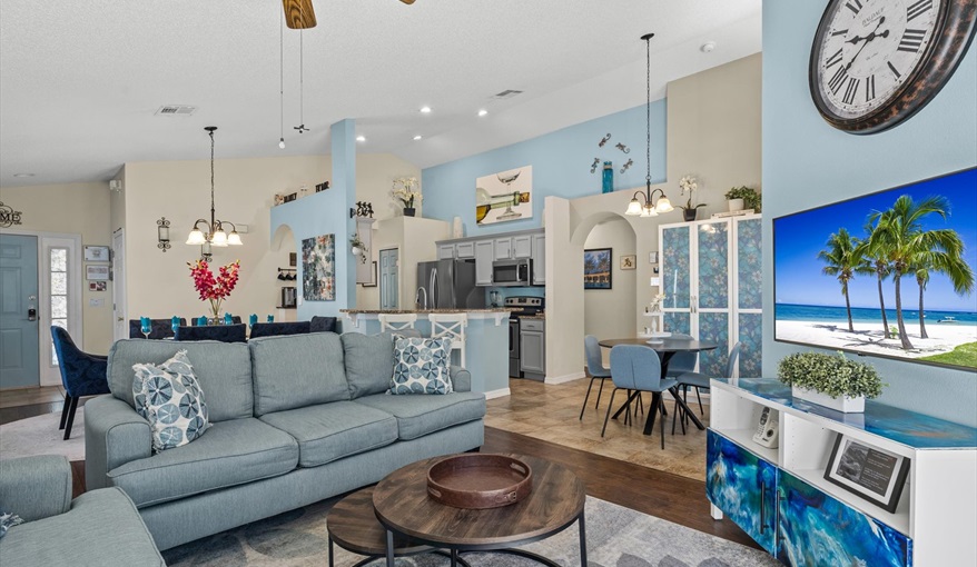 Open-concept layout connecting living room, dining area, and pool access.. For the Best Disney Vacation-Tropical Paradise Villa in Emerald Island Resort, Kissimmee, Orlando