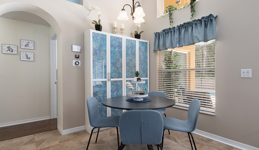 Sunny breakfast nook overlooking the pool — ideal for coffee before rope drop.. For the Best Disney Vacation-Tropical Paradise Villa in Emerald Island Resort, Kissimmee, Orlando