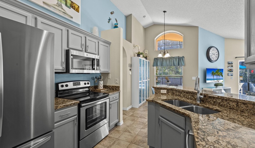 Modern kitchen with stainless steel appliances, cookware, and everything you need to prepare meals.. For the Best Disney Vacation-Tropical Paradise Villa in Emerald Island Resort, Kissimmee, Orlando