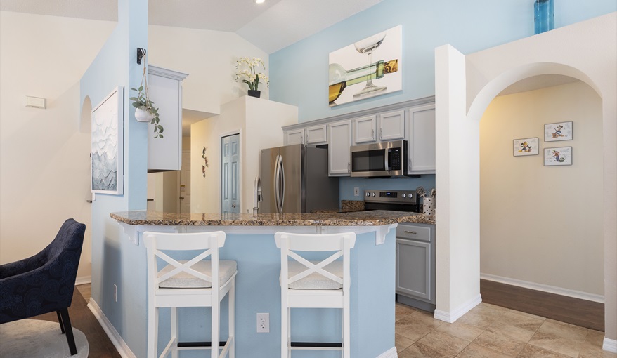 Casual breakfast bar seating—perfect for quick bites or morning coffee.. For the Best Disney Vacation-Tropical Paradise Villa in Emerald Island Resort, Kissimmee, Orlando