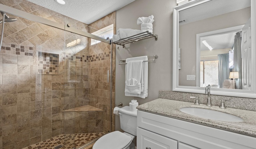 Private master bathroom with walk-in shower, granite vanity, and ample counter space.. For the Best Disney Vacation-Tropical Paradise Villa in Emerald Island Resort, Kissimmee, Orlando