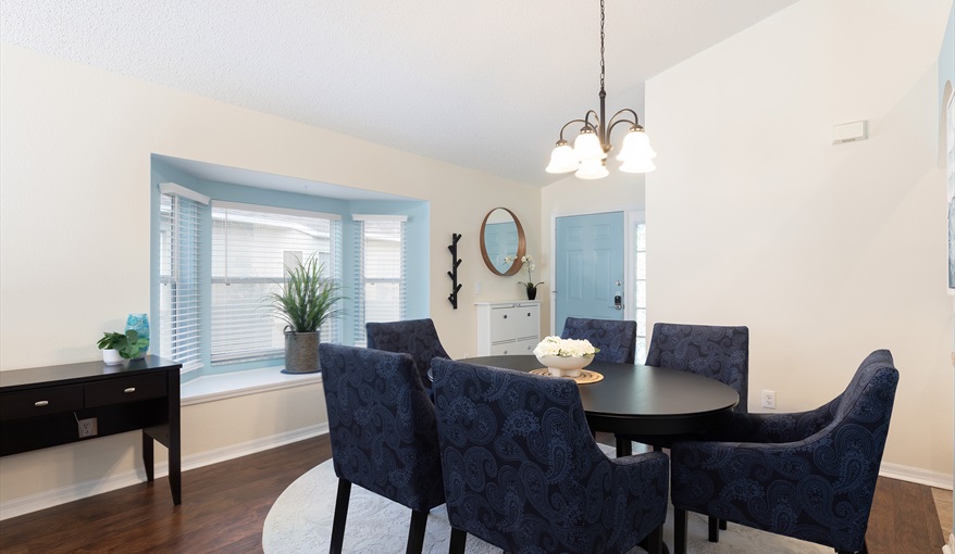 Elegant dining area with seating for six—perfect for family meals or entertaining. For the Best Disney Vacation-Tropical Paradise Villa in Emerald Island Resort, Kissimmee, Orlando
