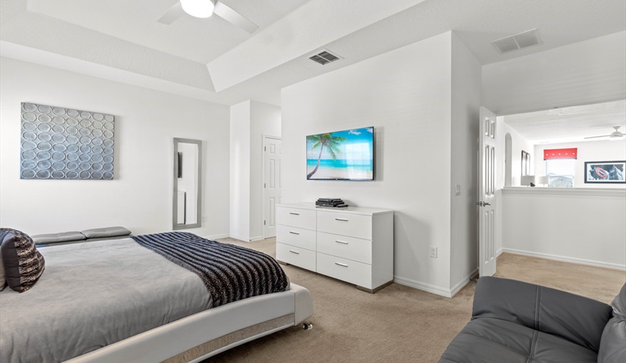 50” wall mounted TV. Goofys Golf Getaway - Luxury Executive Disney Villa on Golf Course Gated Community, South Facing Pool,  No Rear Neighbours and Conservation Views in Providence, Davenport, Orlando