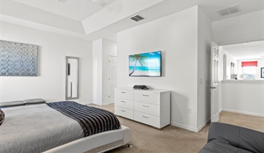 50” wall mounted TV. Goofys Golf Getaway - Luxury Executive Disney Villa on Golf Course Gated Community, South Facing Pool,  No Rear Neighbours and Conservation Views in Providence, Davenport, Orlando