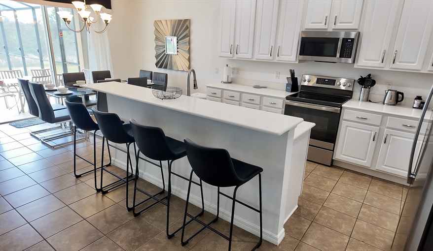 4 stools at kitchen bar for further dining options. Goofys Golf Getaway - Luxury Executive Disney Villa on Golf Course Gated Community, South Facing Pool,  No Rear Neighbours and Conservation Views in Providence, Davenport, Orlando