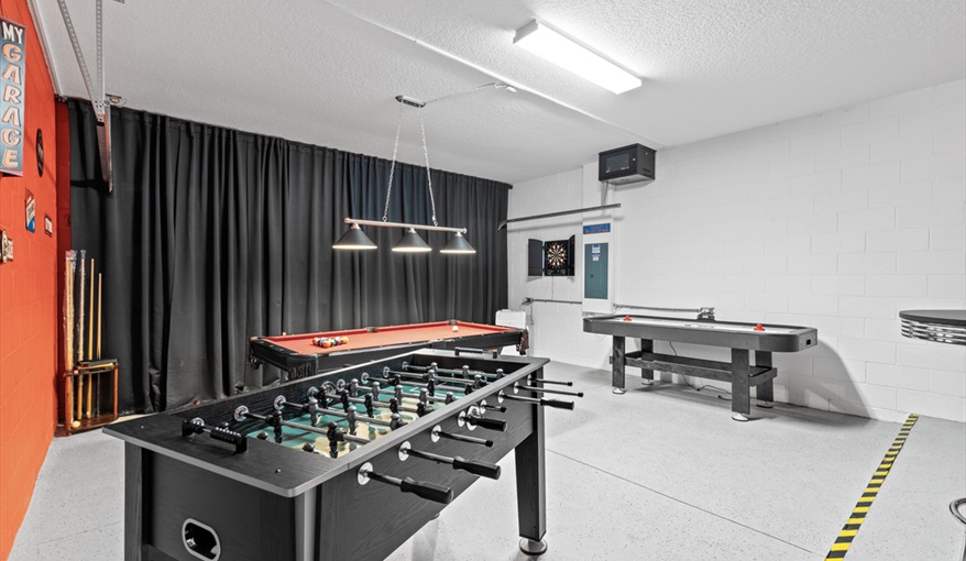 Pool, foosball, air hockey, darts, TV and bar table and stools. Goofys Golf Getaway - Luxury Executive Disney Villa on Golf Course Gated Community, South Facing Pool,  No Rear Neighbours and Conservation Views in Providence, Davenport, Orlando