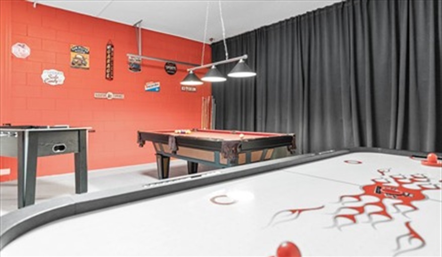 Retro wall art, portable air conditioner. Goofys Golf Getaway - Luxury Executive Disney Villa on Golf Course Gated Community, South Facing Pool,  No Rear Neighbours and Conservation Views in Providence, Davenport, Orlando
