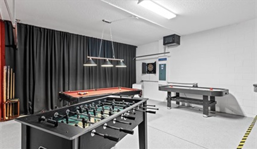 Pool, foosball, air hockey, darts, TV and bar table and stools. Goofys Golf Getaway - Luxury Executive Disney Villa on Golf Course Gated Community, South Facing Pool,  No Rear Neighbours and Conservation Views in Providence, Davenport, Orlando