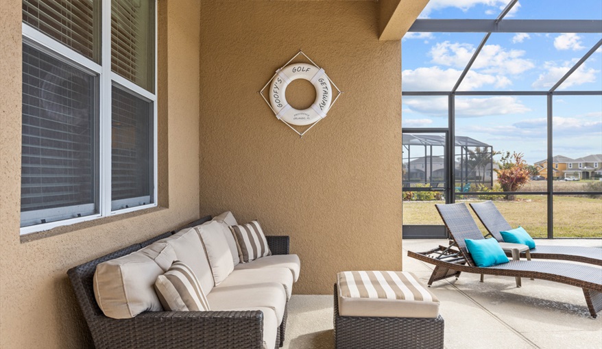 Covered lanai with comfortable seating. Goofys Golf Getaway - Luxury Executive Disney Villa on Golf Course Gated Community, South Facing Pool,  No Rear Neighbours and Conservation Views in Providence, Davenport, Orlando