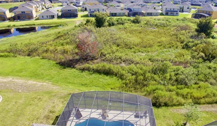 Aerial view of conservation area. Goofys Golf Getaway - Luxury Executive Disney Villa on Golf Course Gated Community, South Facing Pool,  No Rear Neighbours and Conservation Views in Providence, Davenport, Orlando