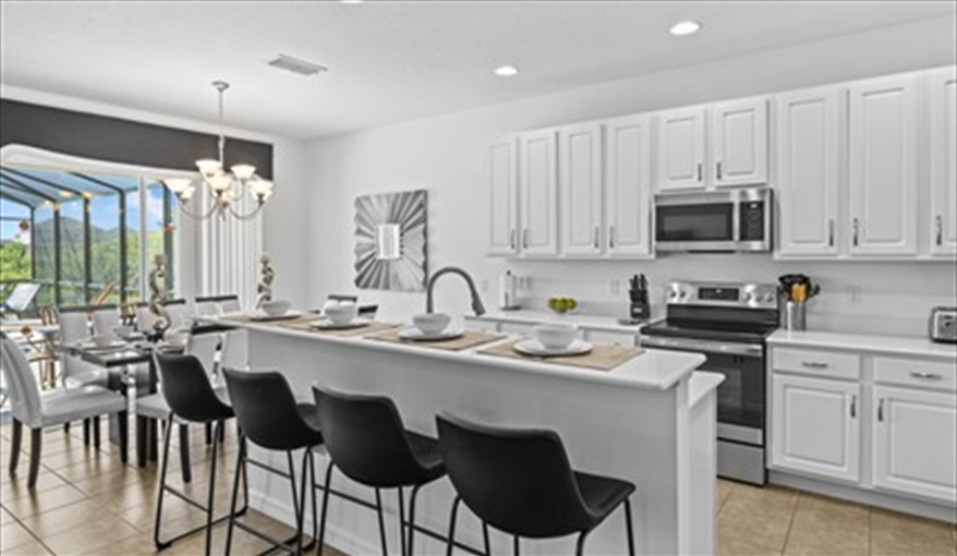 4 stools at kitchen bar for further dining options. Goofys Golf Getaway - Luxury Executive Disney Villa on Golf Course Gated Community, South Facing Pool,  No Rear Neighbours and Conservation Views in Providence, Davenport, Orlando