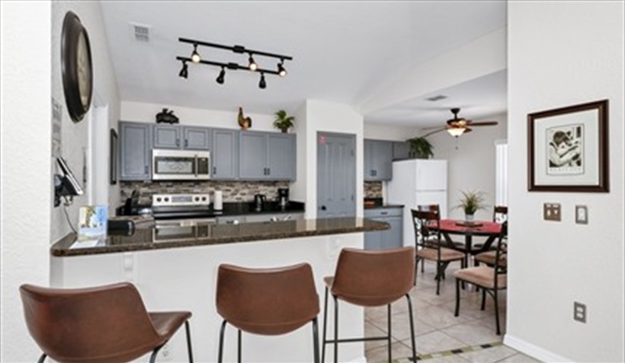 Kitchen with breakfast bar & dining area. Three Palms Villa in Town Centre Reserve, Davenport, Orlando