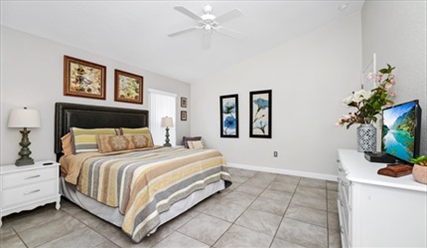 Rear master bedroom with walk in closet. With en-suite leading to pool deck.. Three Palms Villa in Town Centre Reserve, Davenport, Orlando