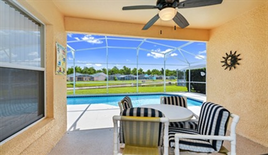 Covered outdoor dining area with access to master bathroom. Three Palms Villa in Town Centre Reserve, Davenport, Orlando