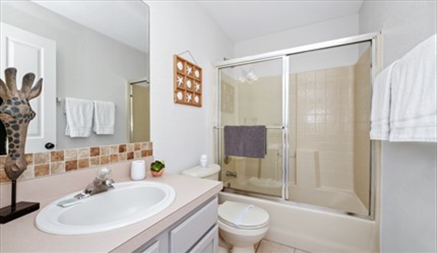Bathroom 3 with tub & overhead shower. Three Palms Villa in Town Centre Reserve, Davenport, Orlando