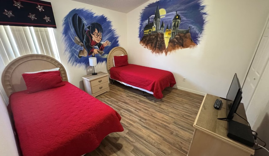 Young Harry Potter fans will love this enchanting themed bedroom with two comfortable twin beds. Daisy's Den  in Indian Ridge, Kissimmee, Orlando