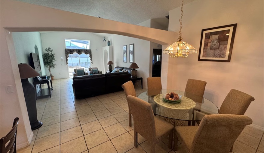 Enjoy meals in the bright dining area with natural skylight and beautiful arched details. Daisy's Den  in Indian Ridge, Kissimmee, Orlando
