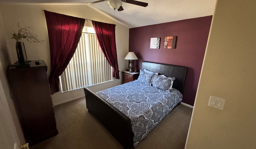 The stylish third bedroom features a contemporary queen bed. Daisy's Den  in Indian Ridge, Kissimmee, Orlando