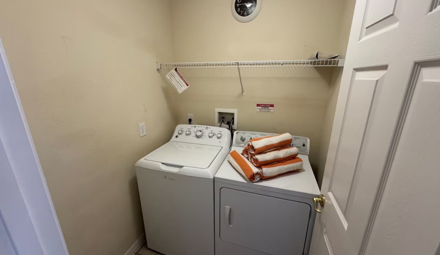 Full-size washer and dryer in dedicated laundry room make extended stays effortless. Daisy's Den  in Indian Ridge, Kissimmee, Orlando