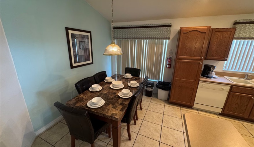 Gather the family for meals at the six-seater dining table.. Daisy's Den  in Indian Ridge, Kissimmee, Orlando