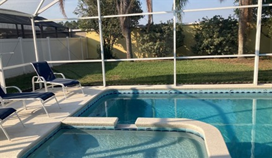 Pool area with loungers. Villa Verna in Indian Creek, Kissimmee, Orlando