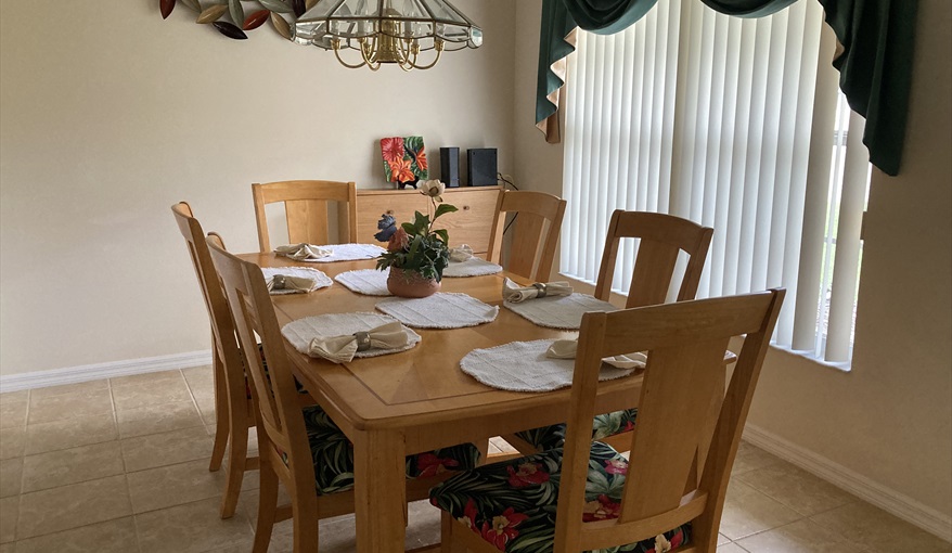 Dining area for more formal dining - table and 6 chairs. Villa Verna in Indian Creek, Kissimmee, Orlando