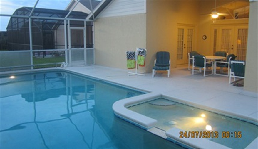 Pool looking across the kiddies paddling pool to the covered lanai. Villa Verna in Indian Creek, Kissimmee, Orlando